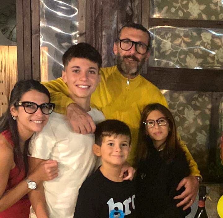 Jessica and Emilio with their family at a celebration
